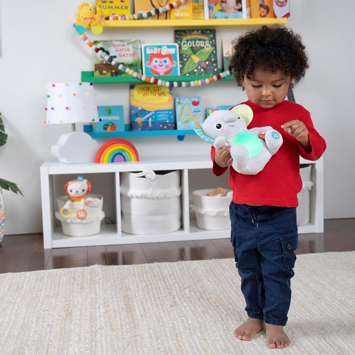 Bright Starts, Spielzeug-Elefantenbaby zum Umarmen mit Lichtern, Liedern, verschiedenen Texturen und mehr, mehrfarbig Toys Bebe Naty Shop
