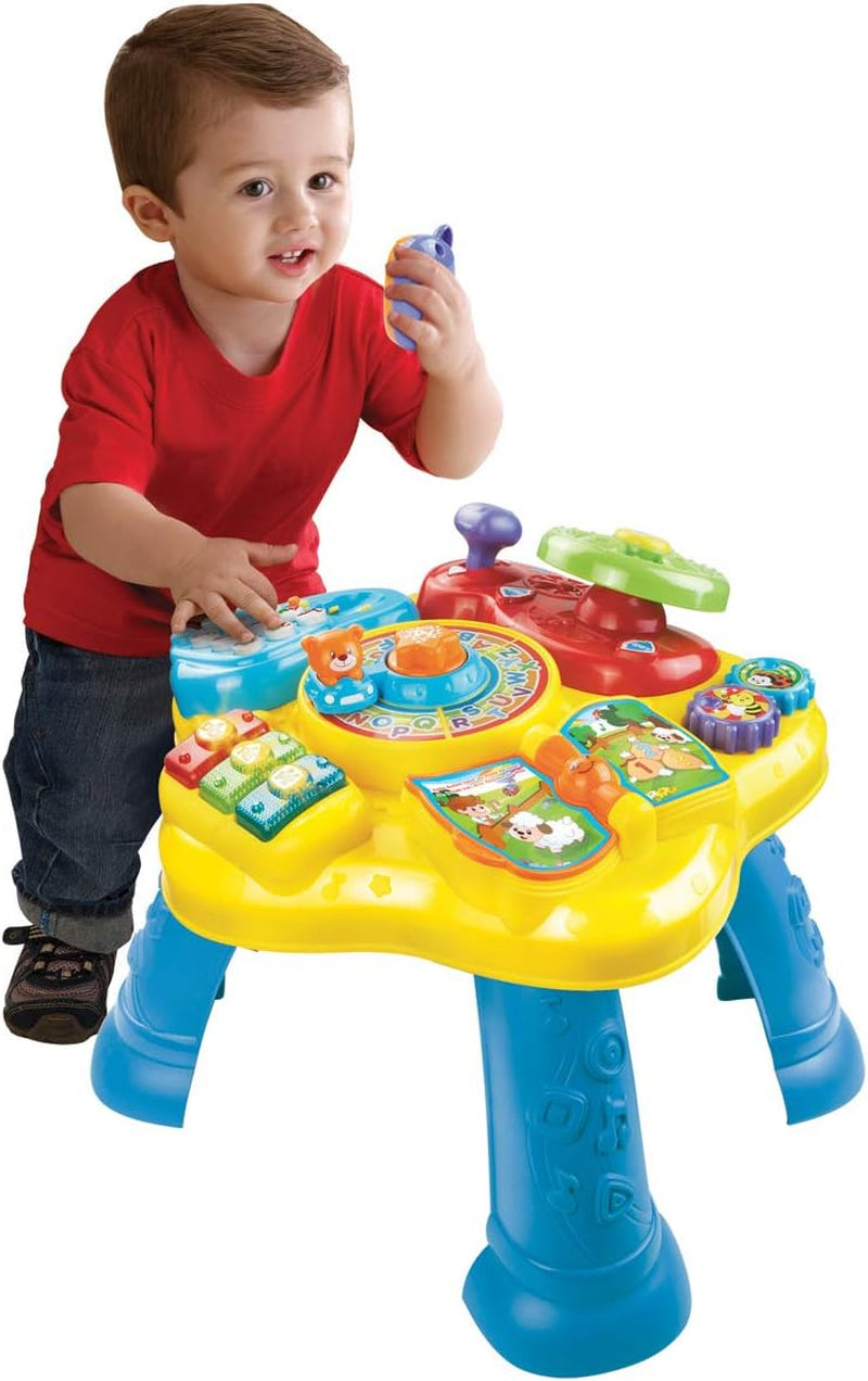 VTech Baby Adventure Spieltisch – Bunter Spieltisch für Babys mit 6 Spielfeldern und interaktiven Elementen & Baby My First Song Book. 6-seitiges buntes Buch und bewegliche Elemente zum Spielen. Bebe Toys Naty Shop