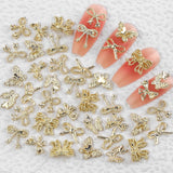 50 Stück 3D Gold Bow Nail Charms Butterfly Nail Art Charms Legierung Bogen Nagel Charms Nägel Zubehör Schleife Nagelschmuck Metall Schleifen Schmetterling Nageldesign Nagelanhänger Nailart Strasssteine